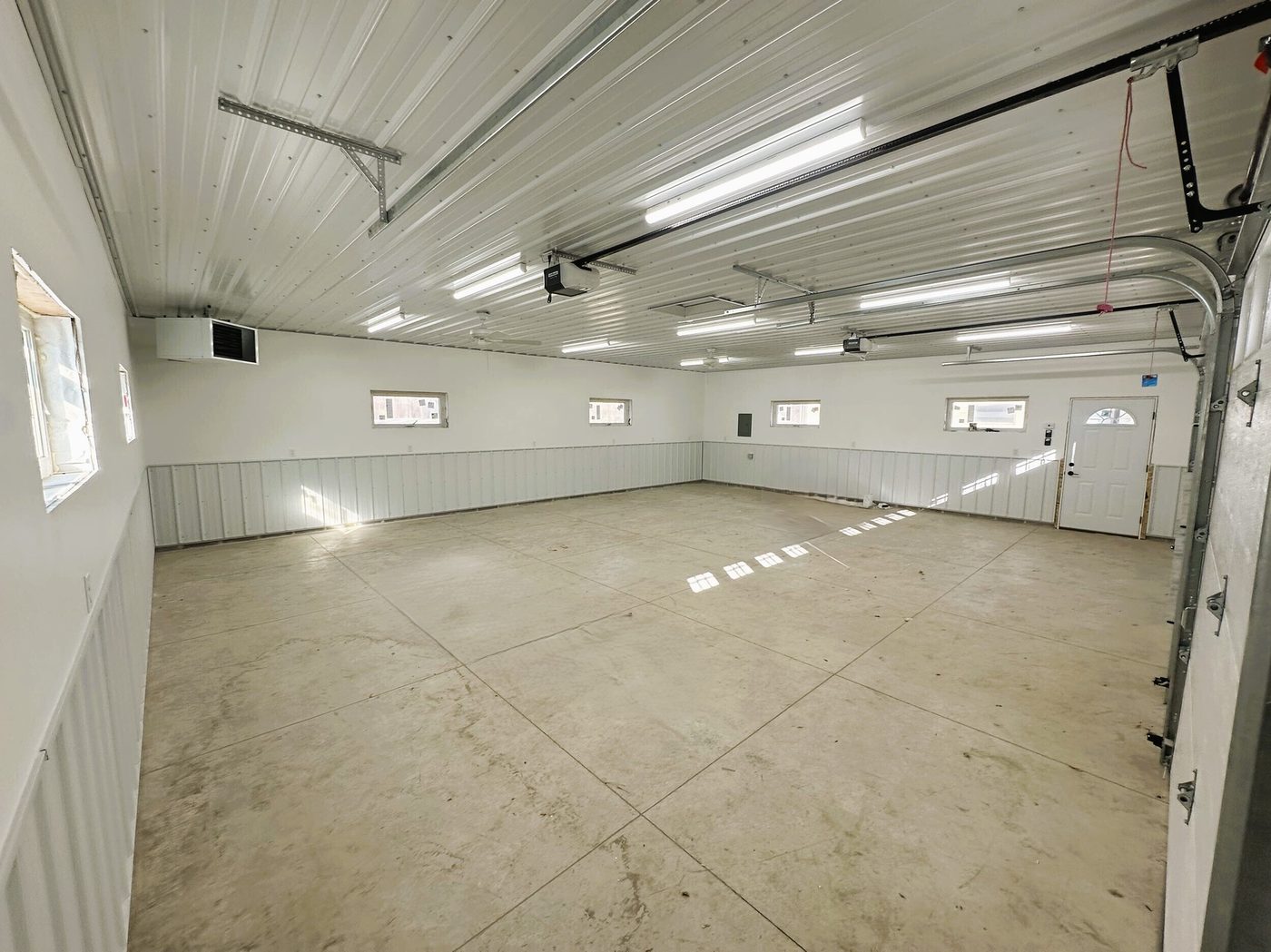 Finished garage interior with insulated walls by BN Builders