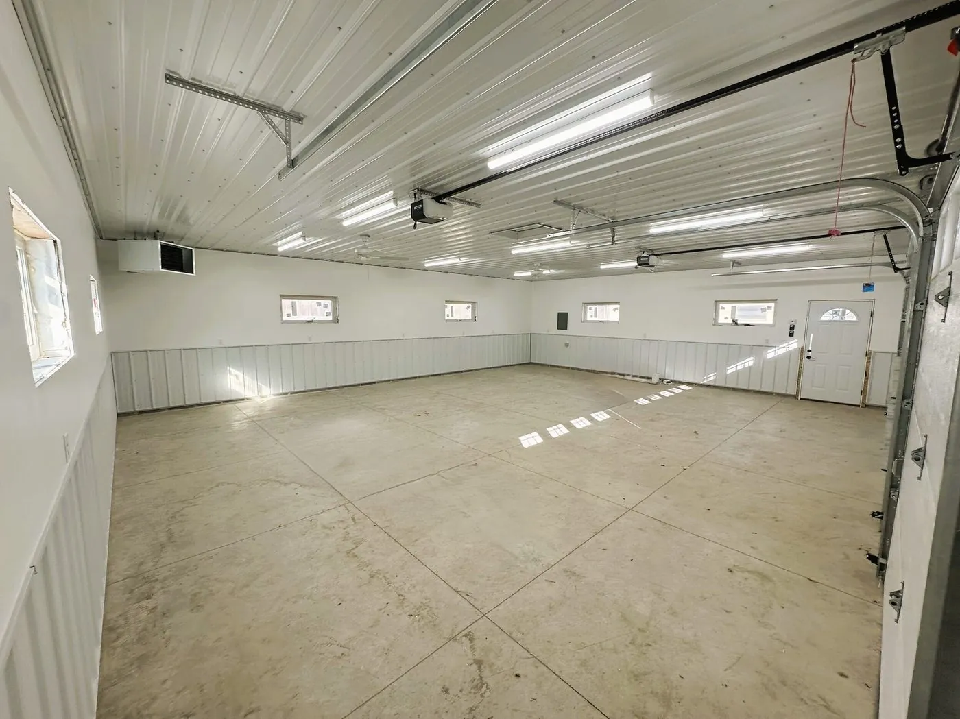 Finished garage interior with insulated walls by BN Builders