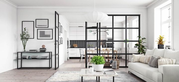 Stylish open plan living area featuring a modern kitchen, dining space, and living room with contemporary furniture and abundant natural light.