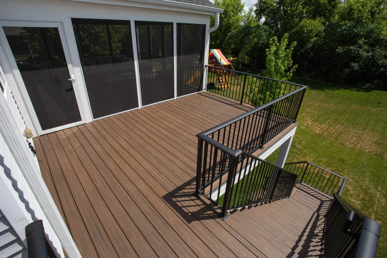 Three season covered trex deck prior lake MN by BN Builders