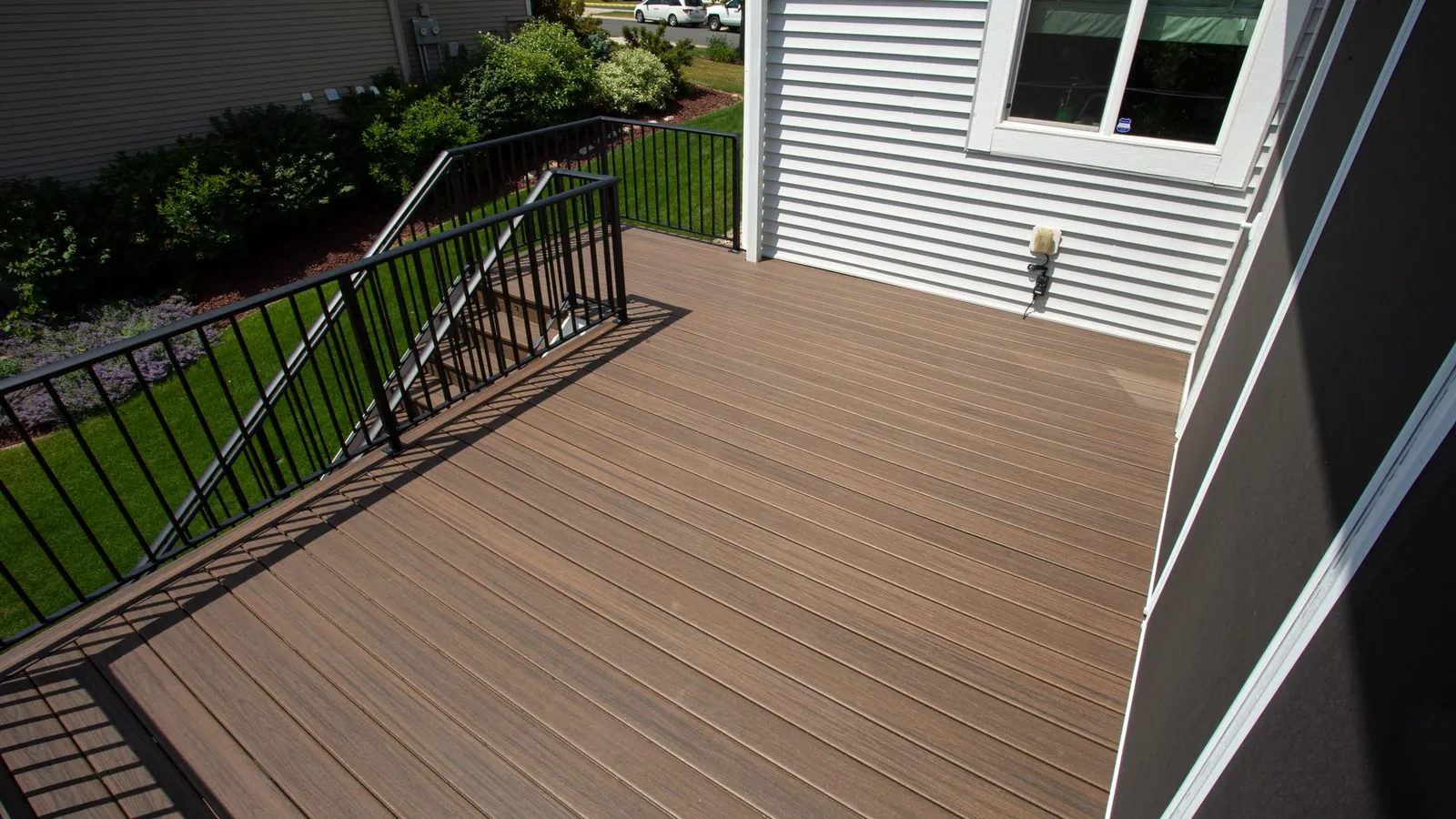 Three season covered trex deck prior lake MN by BN Builders