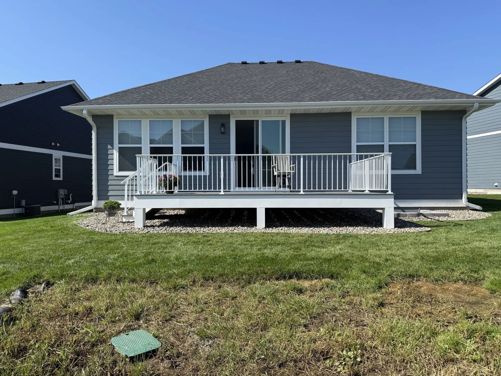 Lakefront deck with cable railings built by BN Builders