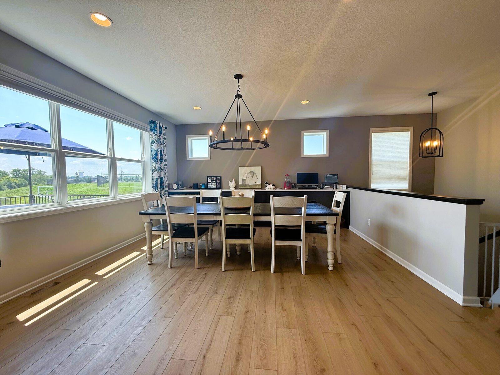 Dining room with a wall of windows, Savage MN by BN Builders